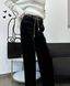 Black velor pants with gold chain, M