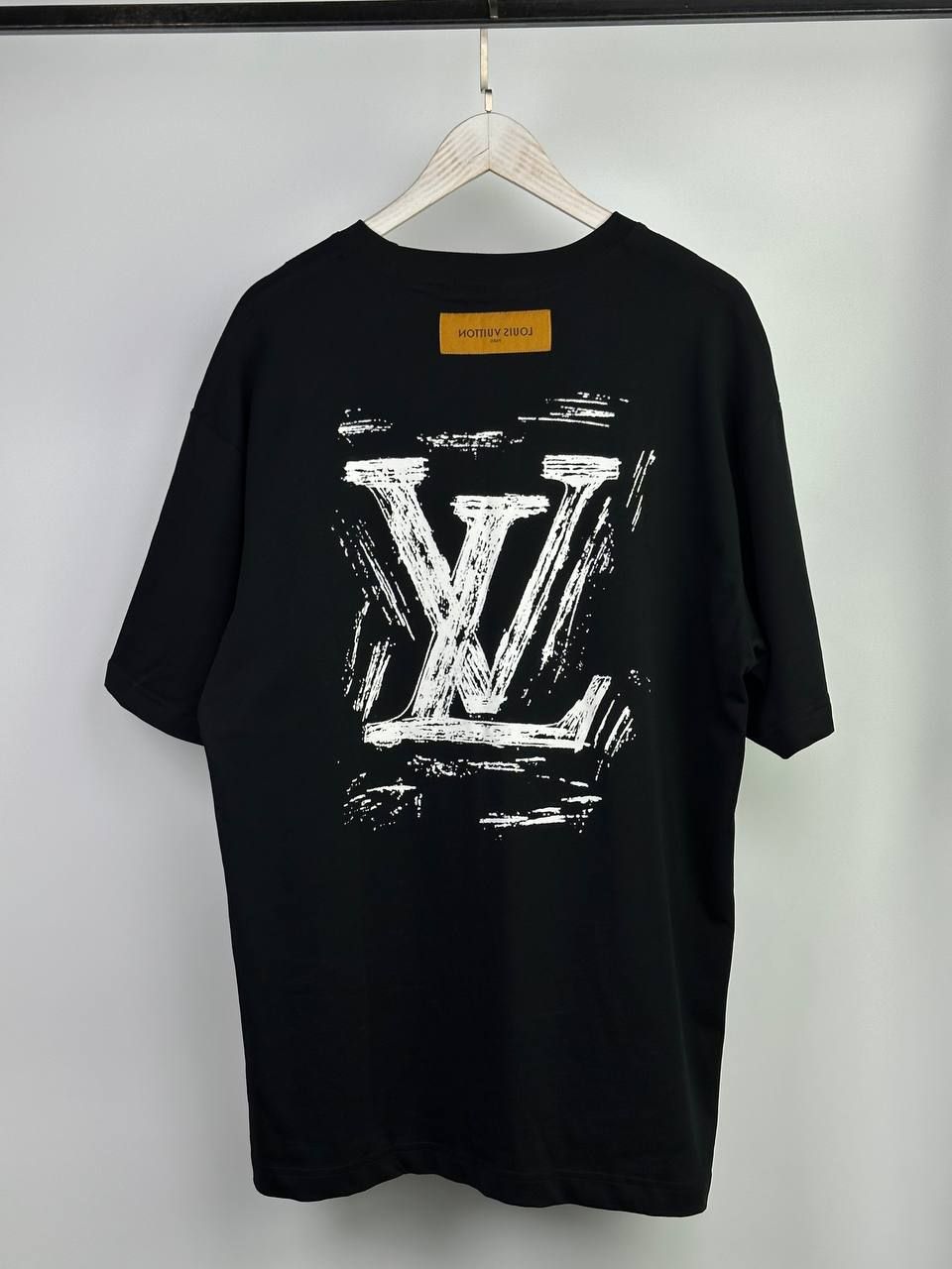 Black T-shirt with writing on the back, S