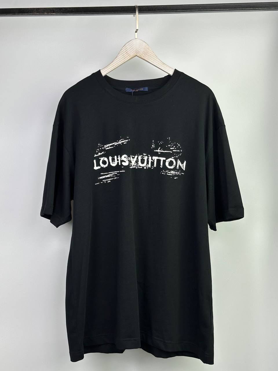 Black T-shirt with writing on the back, L