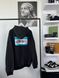 Black hoodie with turquoise print on the back, M