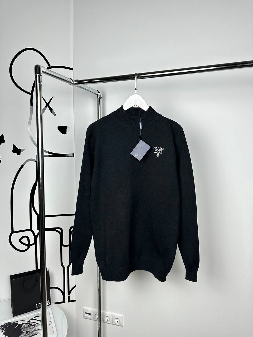 Black sweater with logo on the side, M