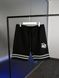 Black shorts with white stripes at the bottom, L