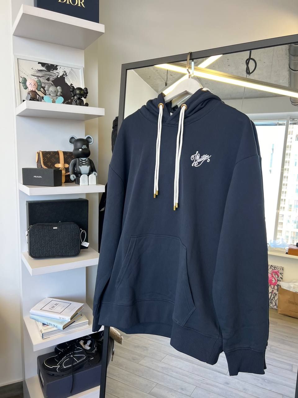 Dark blue hoodie with logo on the back, M