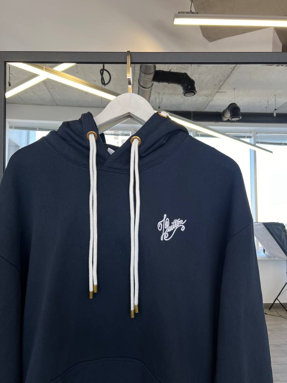 Dark blue hoodie with logo on the back, M