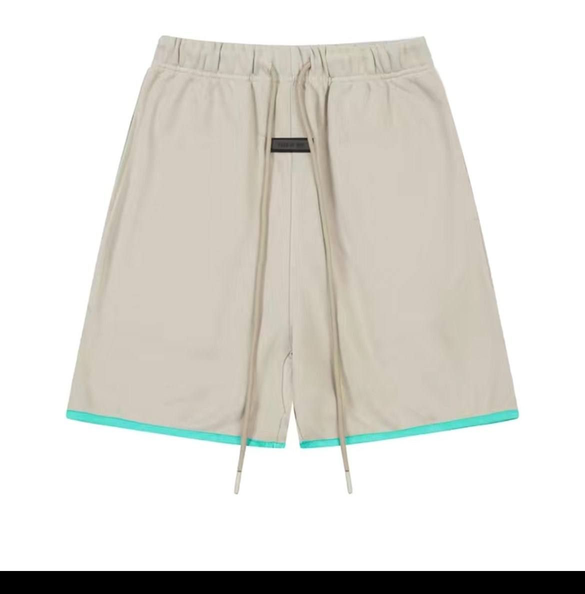 Beige shorts with a green rim at the bottom, S