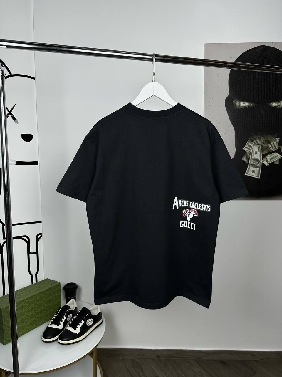 Black T-shirt with white lettering on the side, S