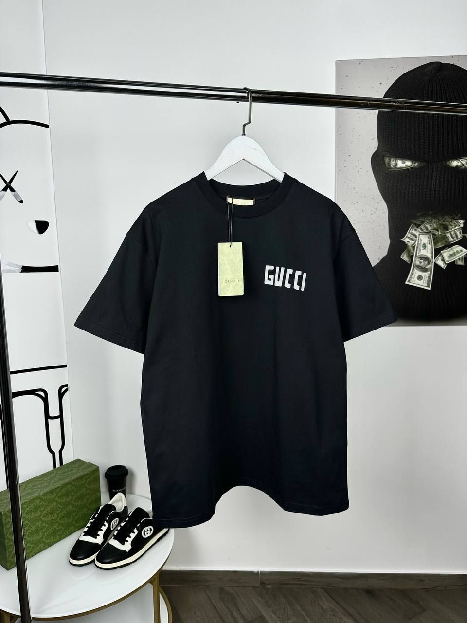 Black T-shirt with white lettering on the side, S