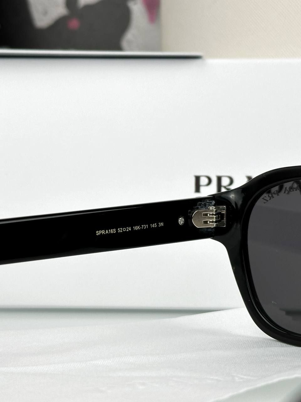 Prada glasses with black frame and blue tint lens, 1