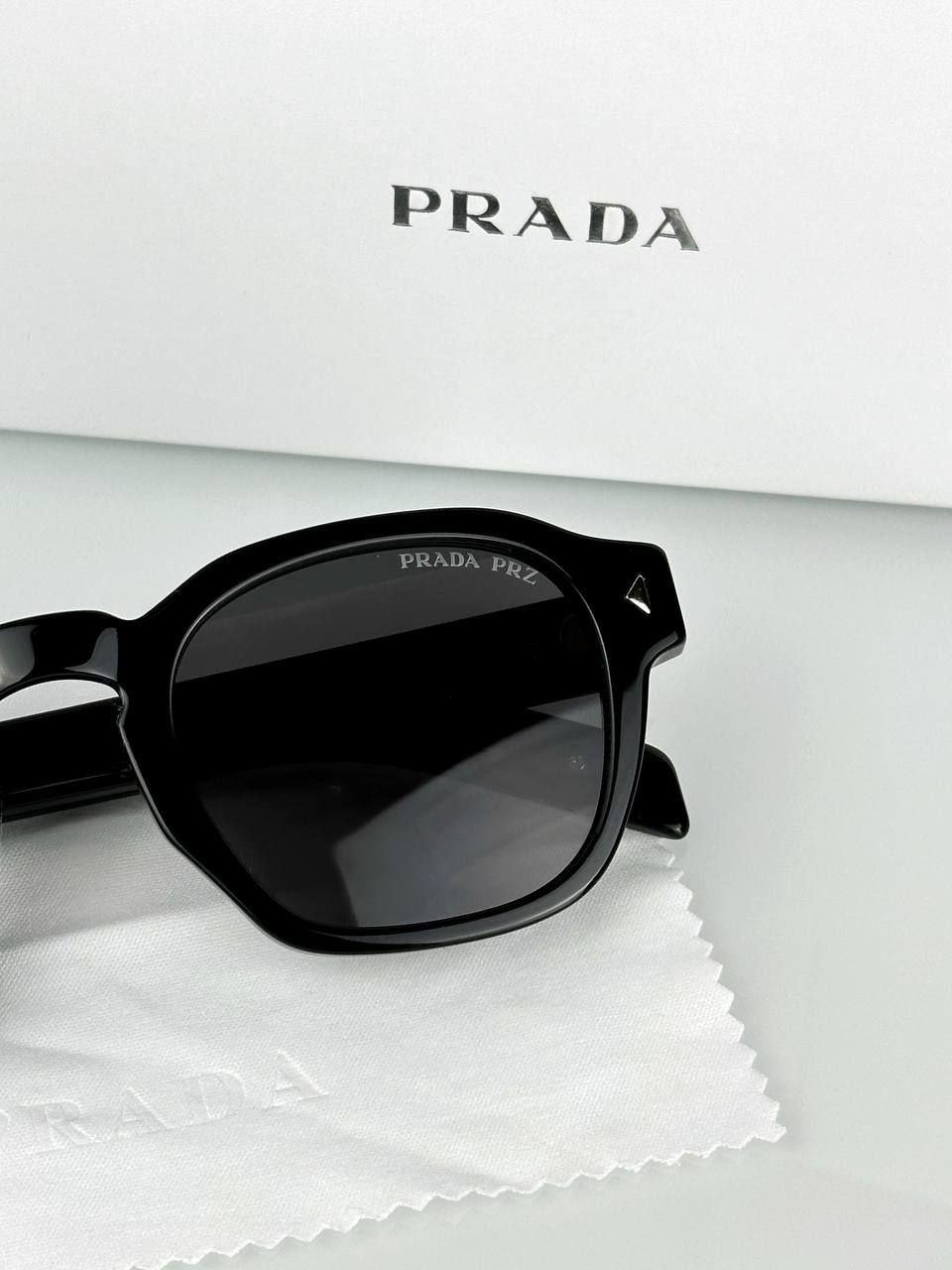 Prada glasses with black frame and blue tint lens, 1