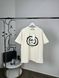 Beige T-shirt with black symbol, L