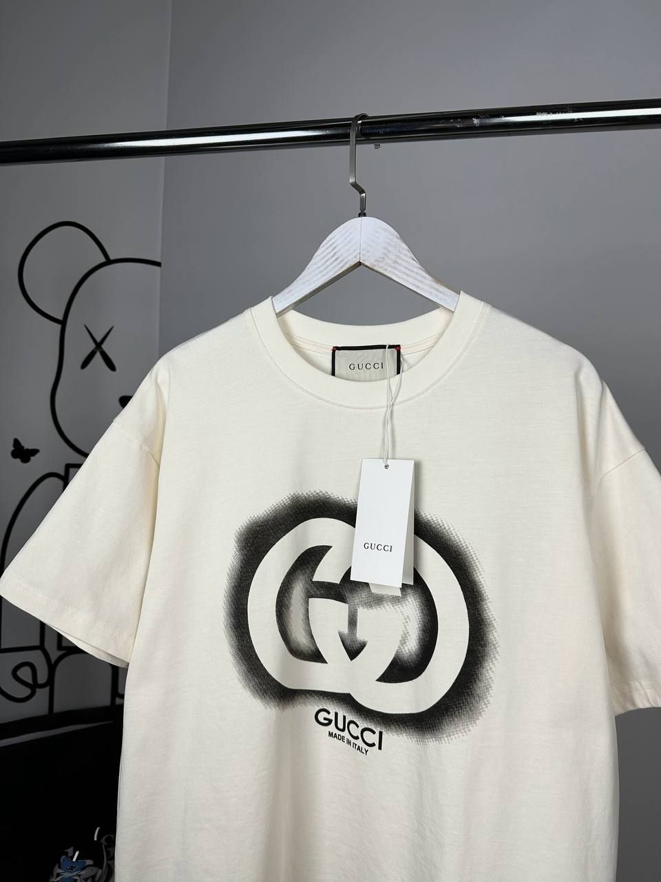 Beige T-shirt with black symbol, L